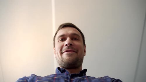 Close Up Smiling Man with Beard in Plaid Shirt