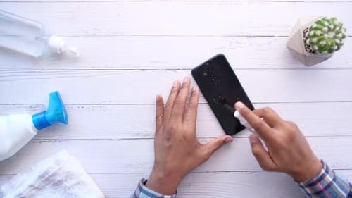 Sanitizing Smartphone Screen to Stop Spread of Virus