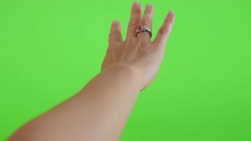 Silver ring with red stone on on woman hand in front of green screen display 4K 2160p UltraHD foota