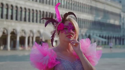 Beautiful Blonde Girl with Mask on the Venice Square
