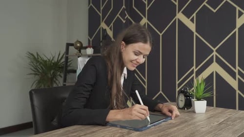 Smiling western business woman, white caucasian person working from home, writing a business