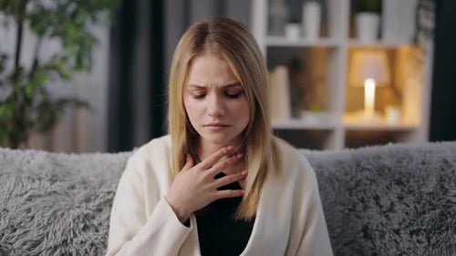 Woman Feeling Sore Throat Home