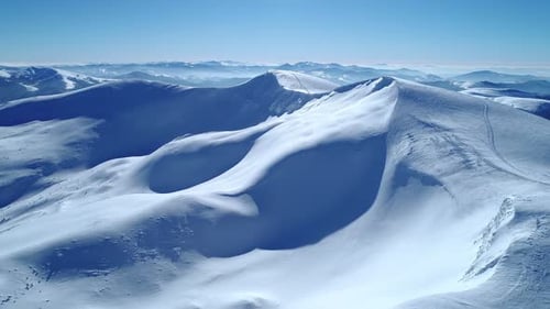 Aerial View of Snow Covered Mountain Range