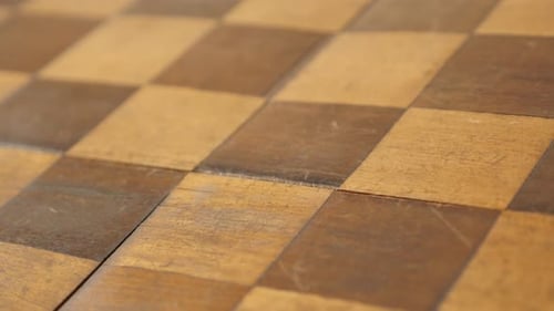 Close-up of wooden board game patina and traces of use 4K 2160p 30fps UltraHD tilting footage - Anc