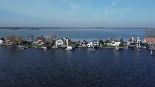 Loosdrechtse houses on dike in the Netherlands between the lakes
