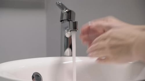 Woman Washes Her Hands