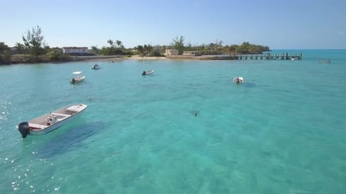 Aerial drone view of a fishing motor boat in the Bahamas, Caribbean.