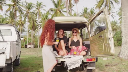 Happy Women Relaxing on Coast of Bali