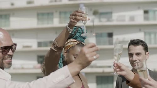 Friends Celebrate with Champagne Toast Outdoors
