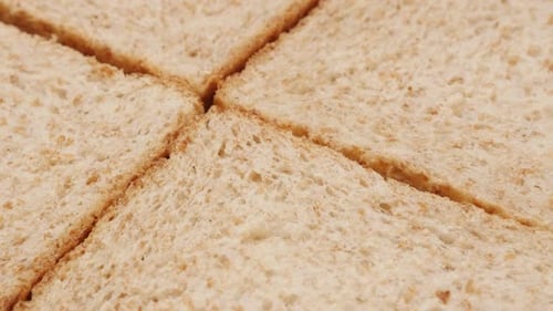 Food concept four pieces complete bread made of full grain close-up 4K 2160p 30fps UltraHD footage