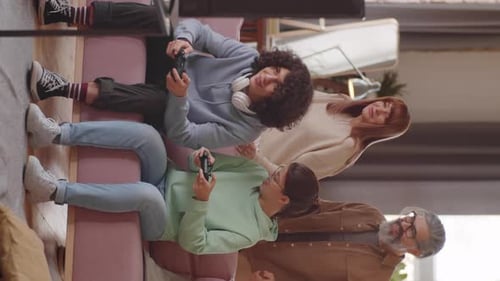 Family Laughing, Playing Video Games at Home Together