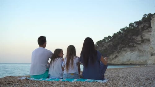 Happy Beautiful Family with Kids on the Beach