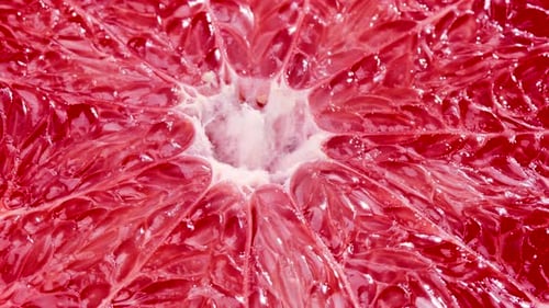 Makroaufnahme der rotierenden Grapefruit-Fleisch-Struktur