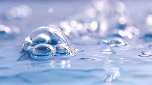 Water Bubbles Forming Macro Close Up