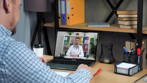 Man Has Telehealth Video Call with Doctor