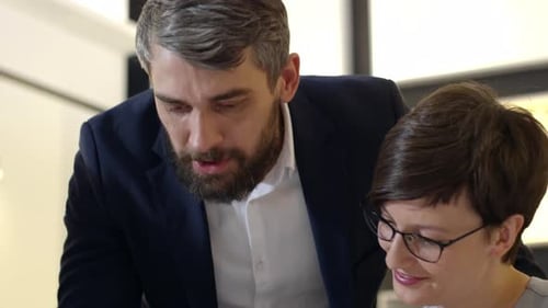 Business Team Collaborating on Project in Modern Workplace