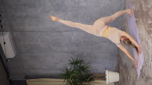 Female Coach Yoga Practicing Yoga Standing in Single Leg Downward Facing Dog Pose Eka Pada Adho