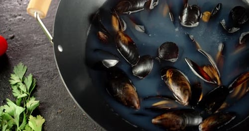 Fresh Mussels Cooking with Cherry Tomatoes and Parsley