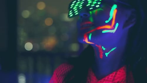 Neon asian woman dancing. Fashion model woman in neon light,