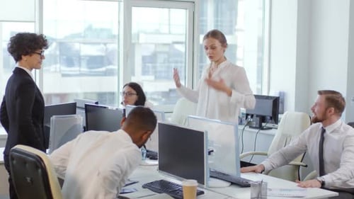 Office Workers Exercising at Their Desktops
