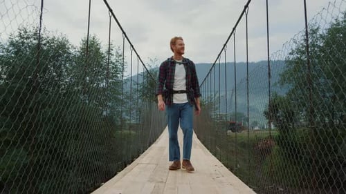 Traveling Man Walk Bridge in Countryside Mountains