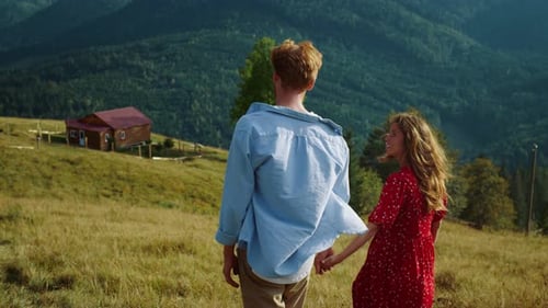 Couple Walks Hand-in-Hand on Mountain, Rural Scene