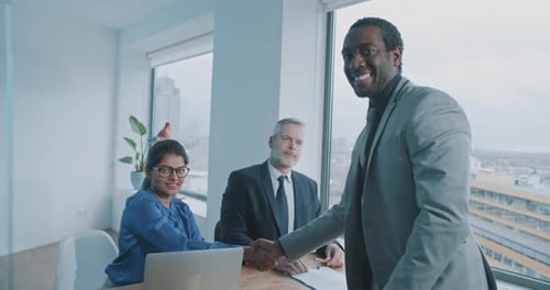 Successful Business Handshake in Modern Office
