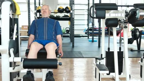 Exhausted Man Wiping Sweat with Towel