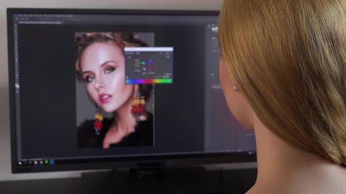Woman Editing Portrait on Computer Screen