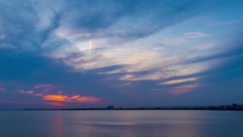 View of the Reflection in the Black Sea Against the Background of the Sky and Sunset