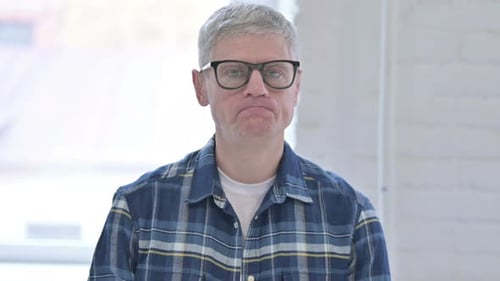 Sad Man Looking Directly at Camera