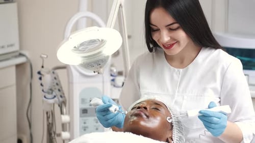 Cosmetologist Performing Facial Treatment in Medical Setting