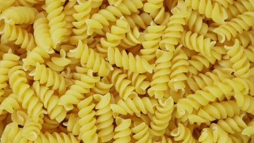 Uncooked Spiral Pasta Close Up Food Background