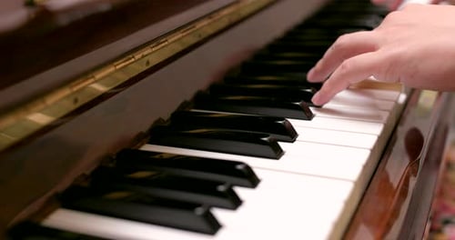 Hands Playing a Piano Close Up