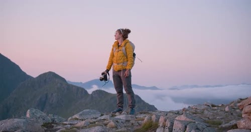 Hiker Takes Mountain Top Photos at Sunrise