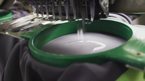 Sewing machine manufacturing clothes in factory