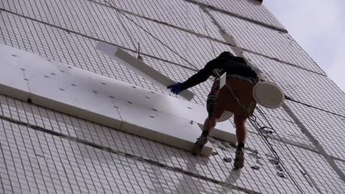 Industrial Climber Insulation of Facade Old High-Rise Building Using Styrofoam