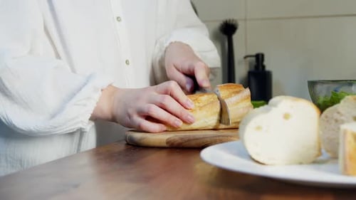 Slicing Bread on a Wooden Cutting Board