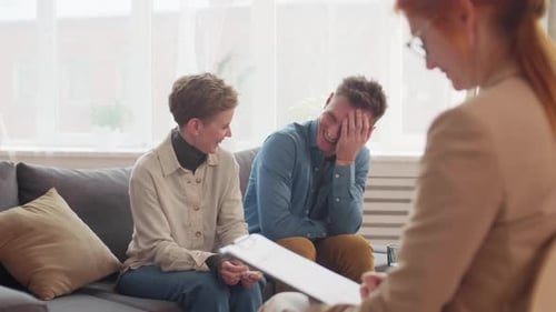 Married Couple Laughing on Psychotherapy Session