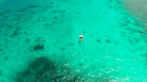Seascape Coral Reef and Blue Sea with Motorboat