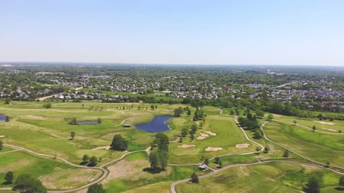 Beautiful Terrain of a National Park with Lakes and Golf Courses Against the Backdrop of a Small