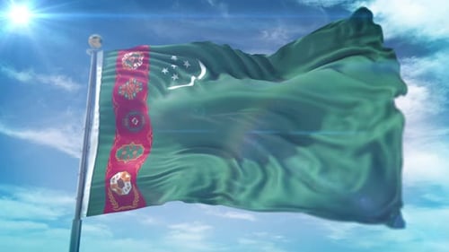 Turkmenistan Flag Waving in Bright Sunlight Against Blue Sky