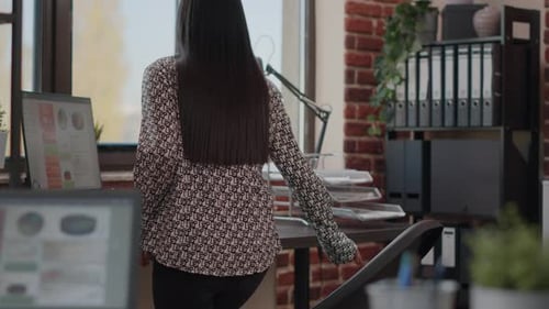 Woman Working on Computer in Modern Office