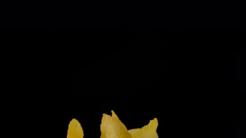 Crispy Potato Chips Filling a Glass Bowl