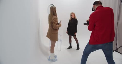 Photographers Working With A Model In The Studio