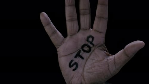Hand with STOP Message Rises