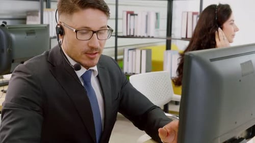 Business People Wearing Headset Working in Office