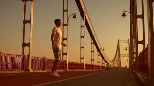 Male Athlete Jumps at the Bridge