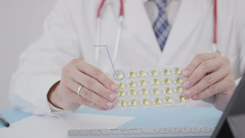 Supplement Blister Pack with Capsules in Doctor's Hand