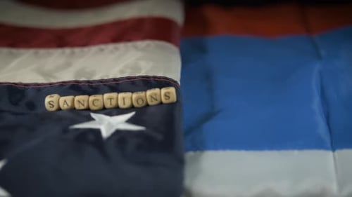 Flags with Word Sanctions on Wooden Blocks